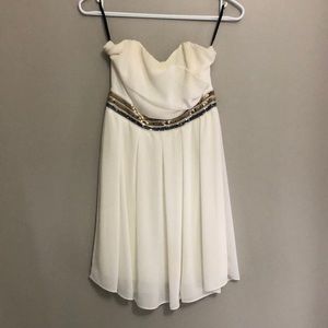 Strapless flowy white TFNC London dress with sparkly detail